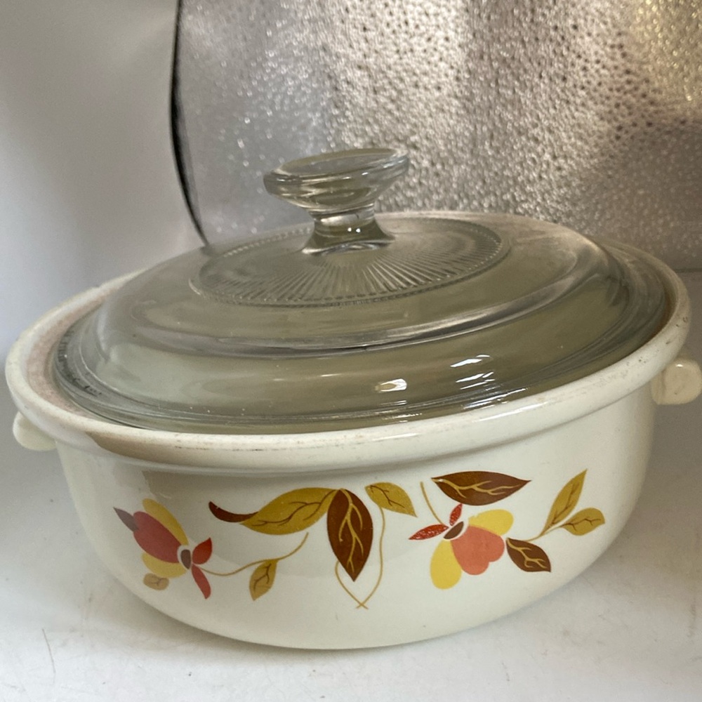 Hall’s casserole dish with cover. 7” x 3.5” Has pretty leaf & flower pattern
